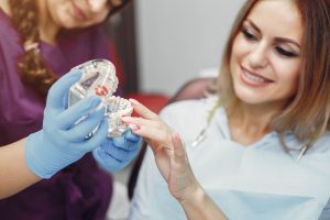 Dental Implant vs. Bridge: Pros, Cons, and Which to Choose?